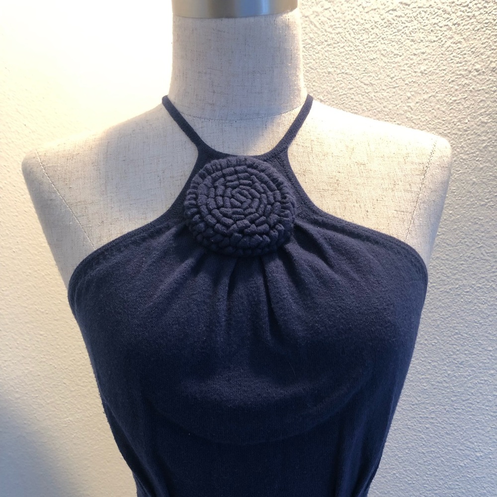 Stunning, fitted, knit tank top will turn heads w/ unique neckline & bodice.